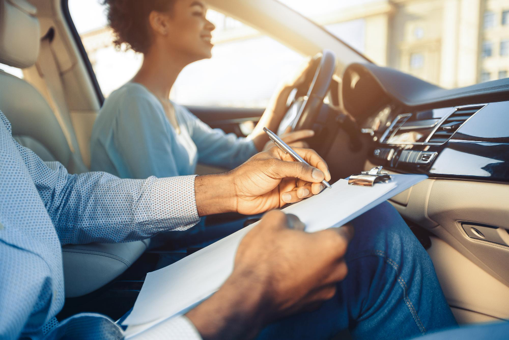 Driving instructor supporting a licensed driver on a refresher lesson in Coventry